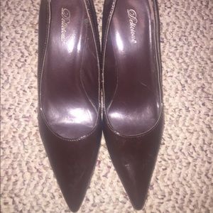 Chocolate brown heels with pointed tips.
